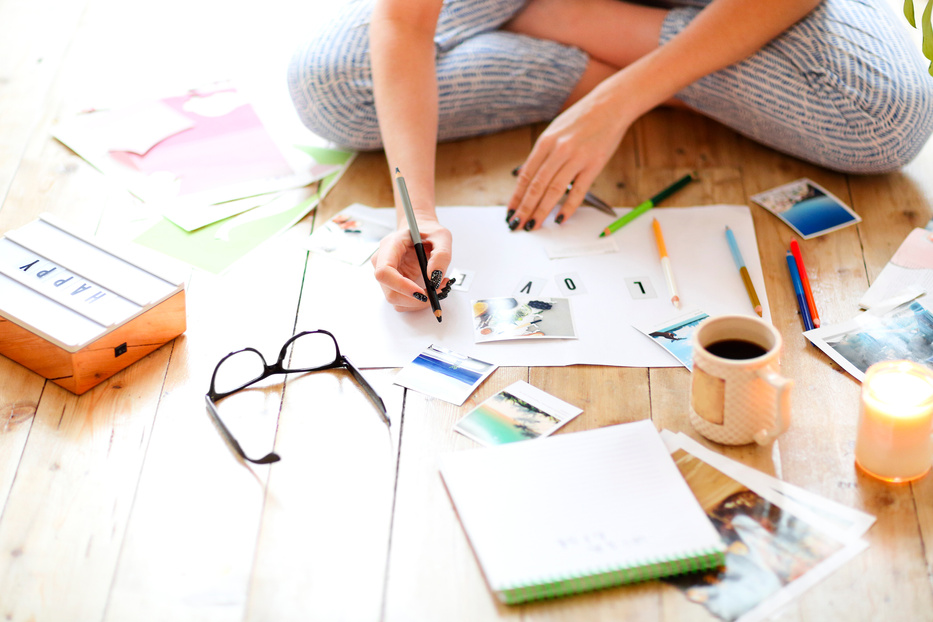 Young Brunette Woman Creating Her Feng Shui Wish Map Using Sciss